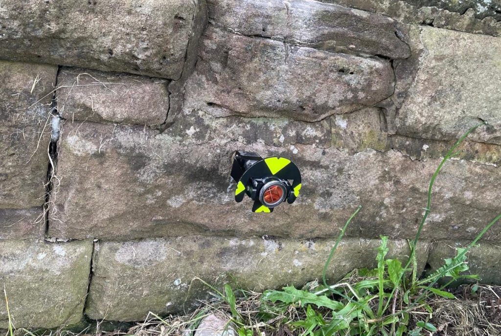 Monitoring a fixed point on a church wall for movement